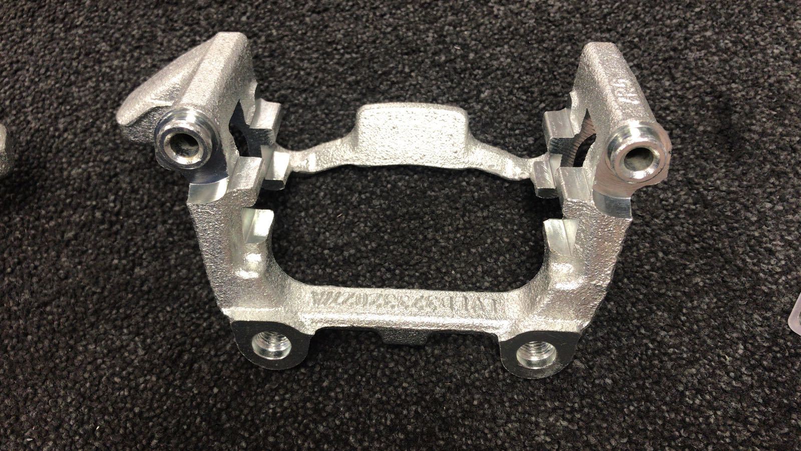 REAR BRAKE CALIPER CARRIER BRACKET LH NS OCTAVIA SUPERB YETI TOURAN JETTA 256M