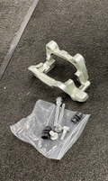 REAR BRAKE CALIPER CARRIER BRACKET LH NS OCTAVIA SUPERB YETI TOURAN JETTA 256M