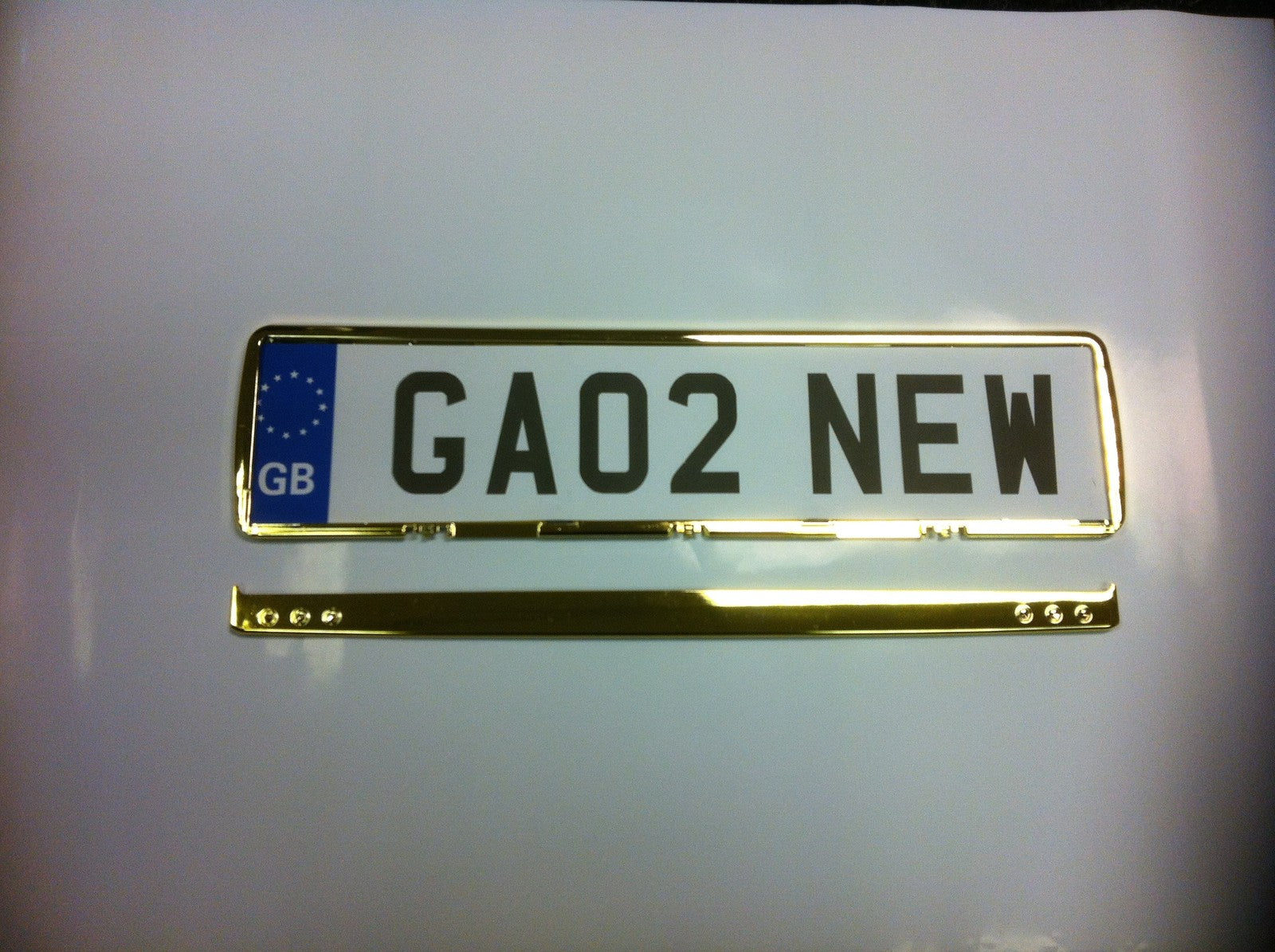 NUMBER PLATE SURROUND  GREY 