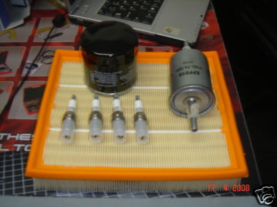 VAUXHAL TIGRA OIL AIR FUEL FILTER & 4 SPARK PLUGS
