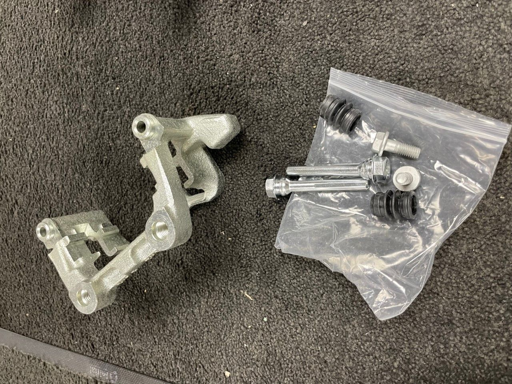REAR BRAKE CALIPER CARRIER BRACKET LH NS OCTAVIA SUPERB YETI TOURAN JETTA 256M
