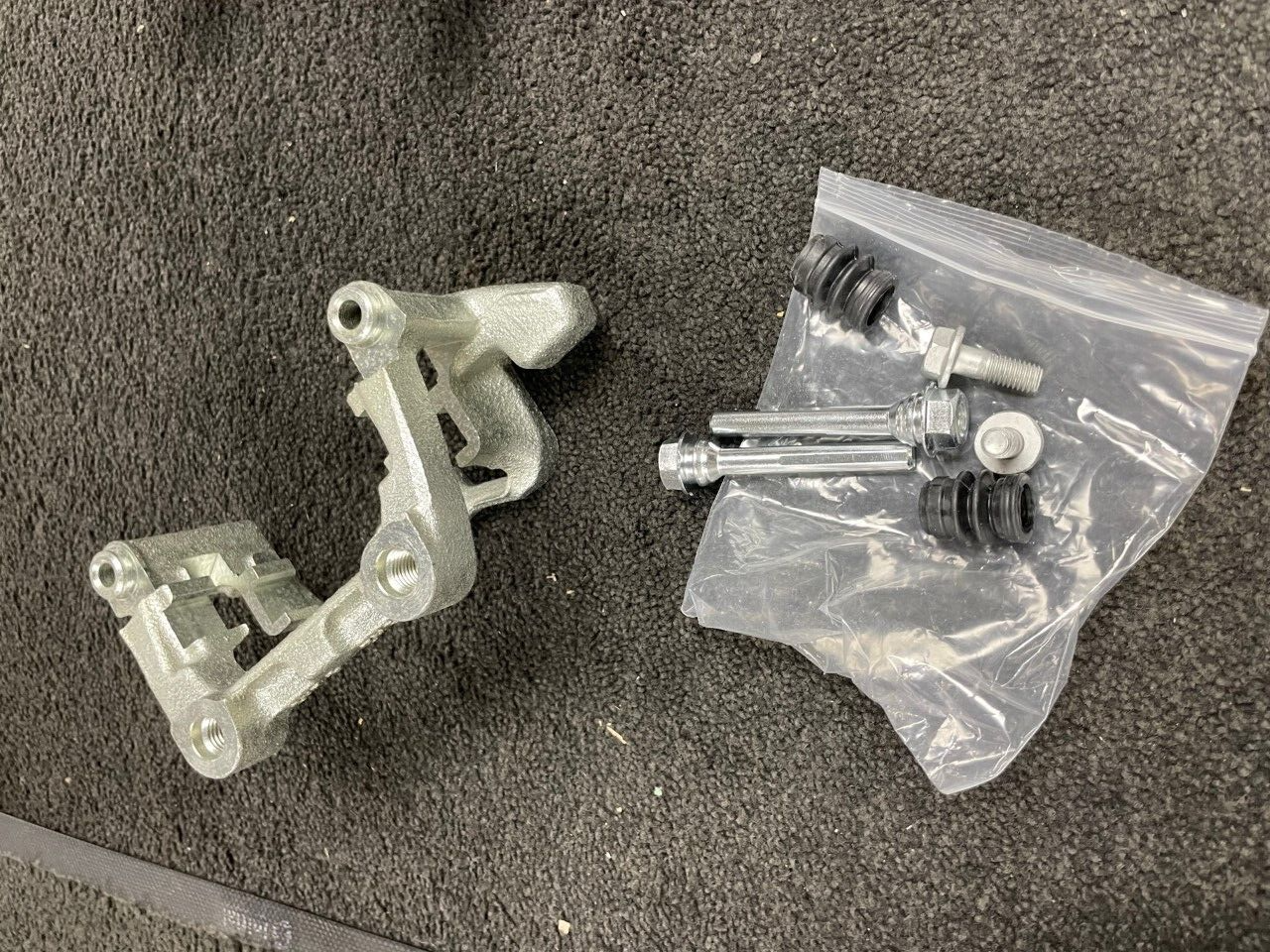 REAR BRAKE CALIPER CARRIER BRACKET LH NS OCTAVIA SUPERB YETI TOURAN JETTA 256M