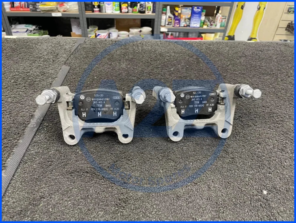 GENUINE 2 REAR BRAKE CALIPER CARRIER BRACKET PADS CADDY MK4 4 MOTION ALLTRACK